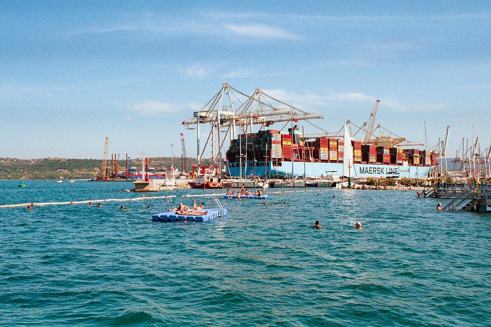 a group of boats floating on top of a body of water