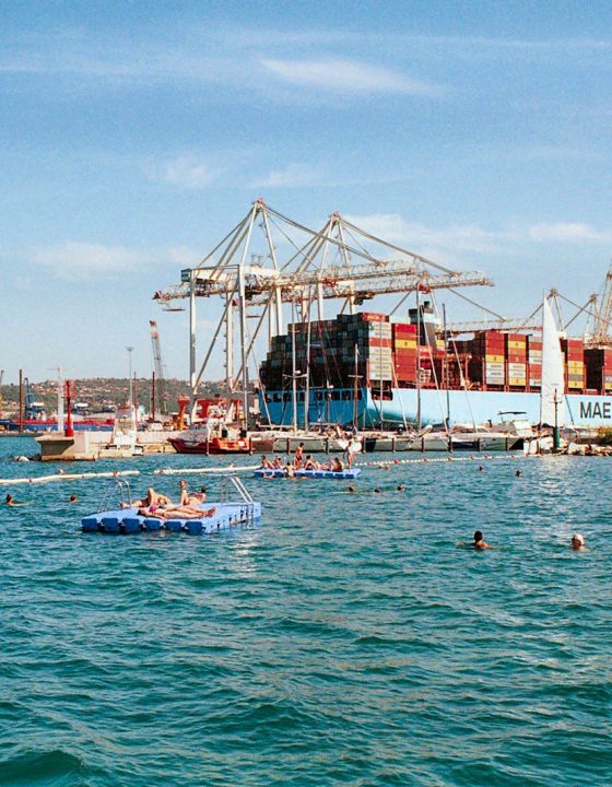 a group of boats floating on top of a body of water